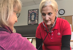 Photo of Colleen Sasso, assisting a client